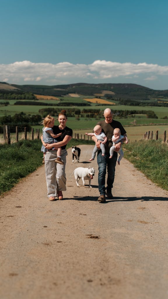 Family playing at Aberdeenshire farm
